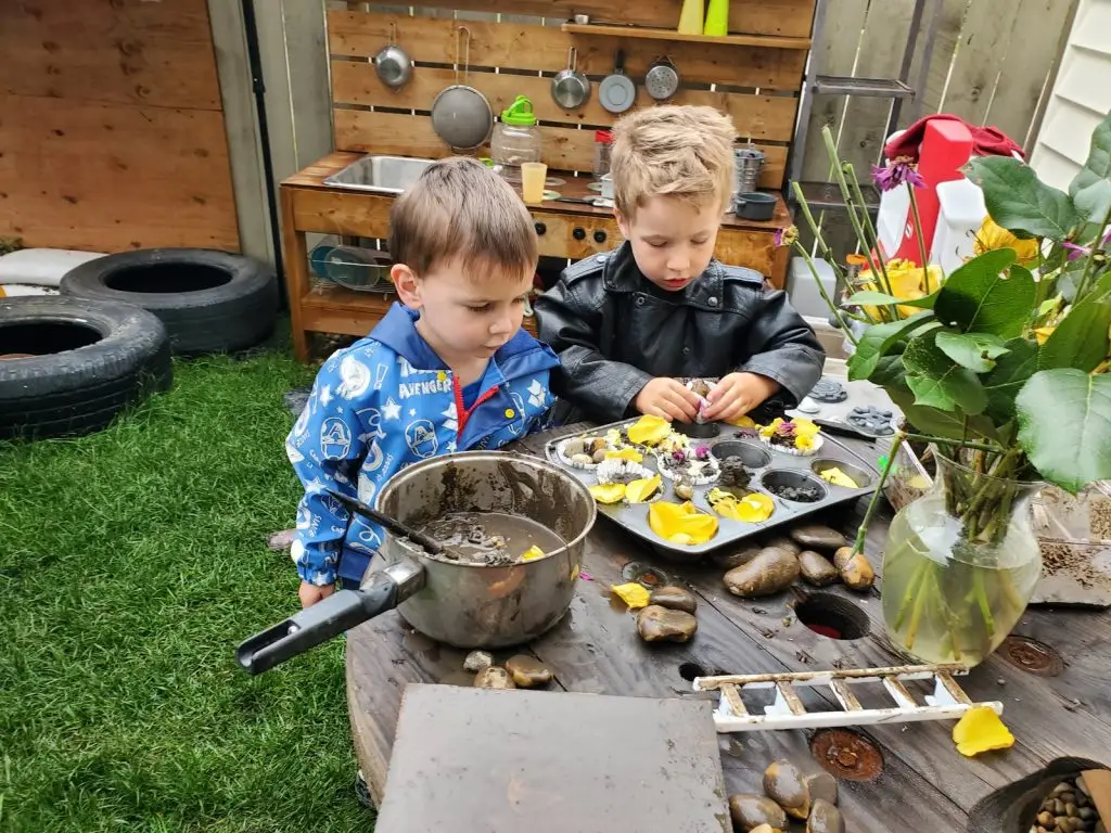 Children engaging in mud play.