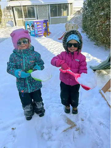 Children with shovels and snow
